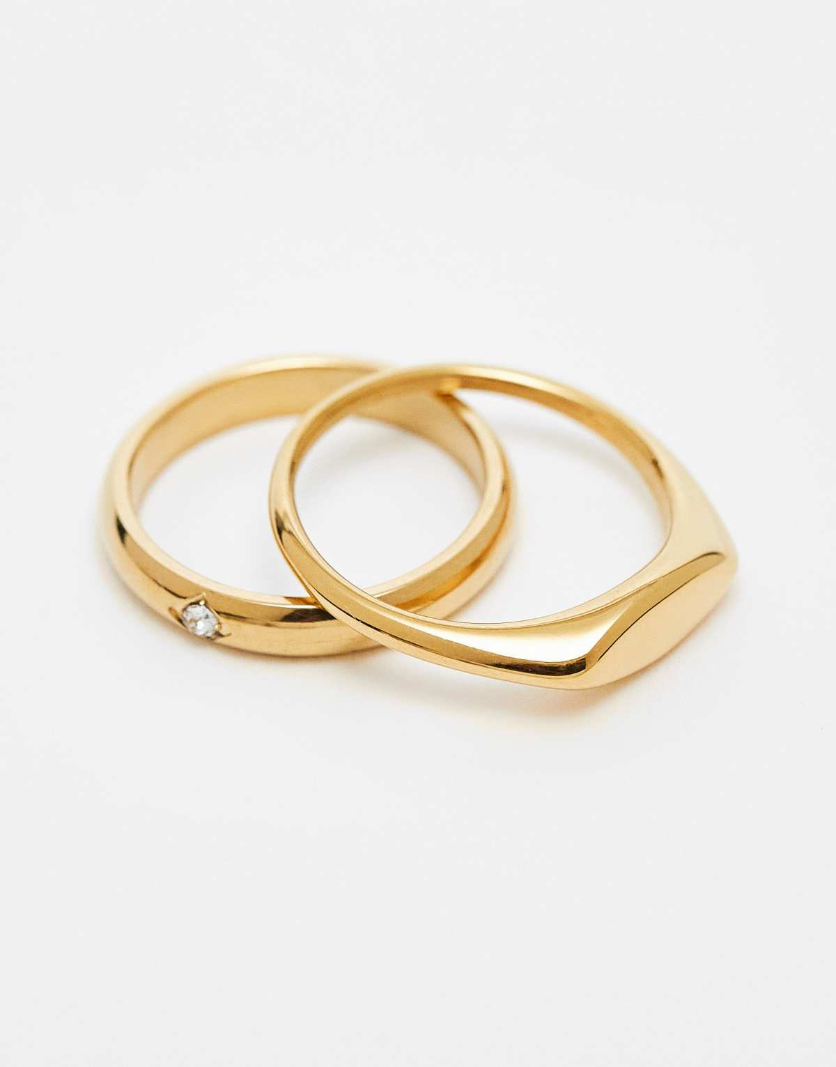 ASOS DESIGN 2 pack waterproof stainless steel signet rings with crystal in gold tone