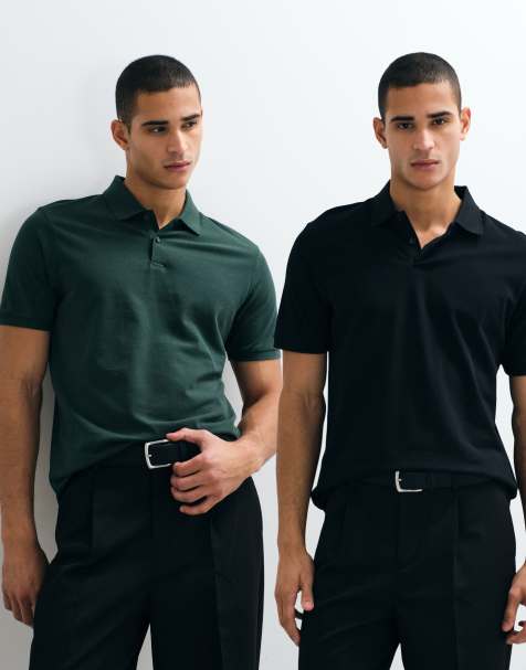 ASOS DESIGN – 2er-Pack Basic-Polohemden aus Pikee in Schwarz und Dunkelgrün mit Regular-Fit-Schnitt - view 1