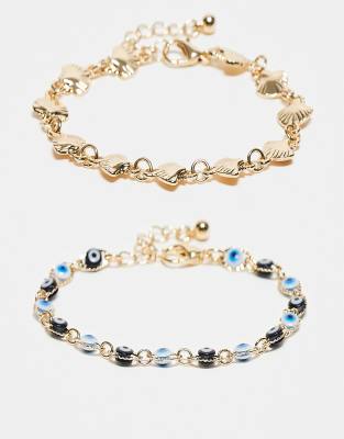 ASOS DESIGN - 2er-Pack goldfarbene Armbänder mit Kunstmuschel- und Augendesign