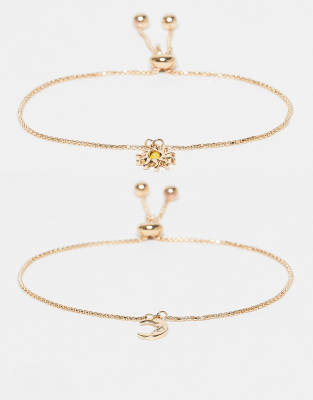ASOS DESIGN - 2er-Pack goldfarbene Armbänder mit Sonne- und Mond-Design
