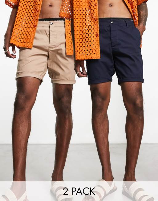 ASOS DESIGN – 2er-Pack mittellange Chino-Shorts mit engem Schnitt in Steinbeige und Marineblau 