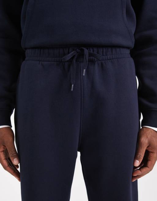 ASOS DESIGN – 2er-Pack schmal zulaufende Basic-Jogginghosen in Schwarz und Marineblau, 5 von 5