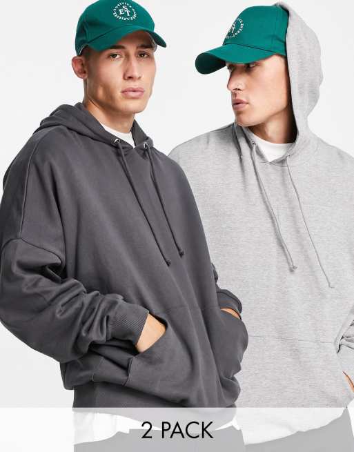 ASOS DESIGN – 2er-Pack sehr übergroße Kapuzenpullover aus Baumwollmix in verwaschenem Schwarz/Kalkgrau - MULTI