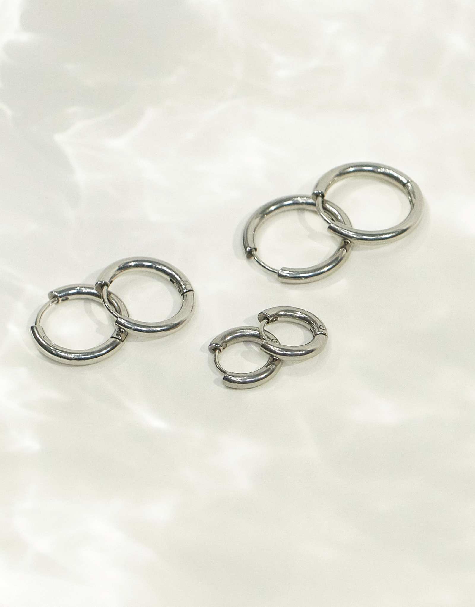 ASOS DESIGN 3-х дюймовые водонепроницаемые серьги-кольца из нержавеющей стали диаметром 9 мм, 12 мм и 14 мм в серебряной упаковке
