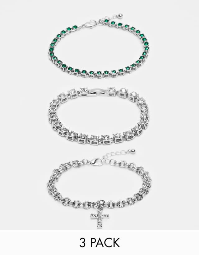 ASOS DESIGN 3 pack chain bracelet set with clear and green crystals and cross charm in silver tone