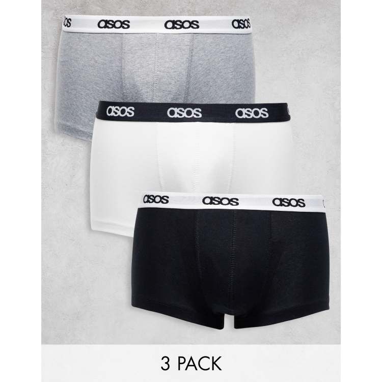 ASOS DESIGN jersey trunks in black with blue branded waistband