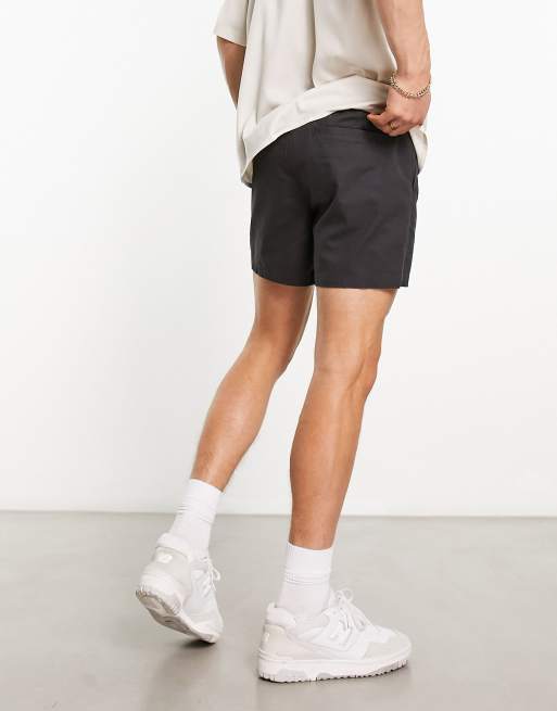 ASOS DESIGN shorter length slim shorts in washed black