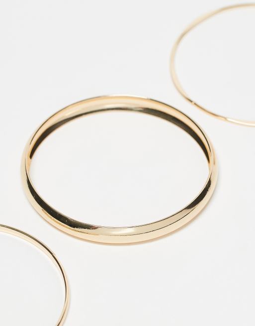 ASOS DESIGN – 3er-Pack goldfarbene Armreife in minimalistischen Designs, 3 von 4