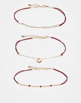 ASOS DESIGN - 3er-Set Fußkettchen mit Herzanhänger in Gold mit Kordel in Rot-Goldfarben