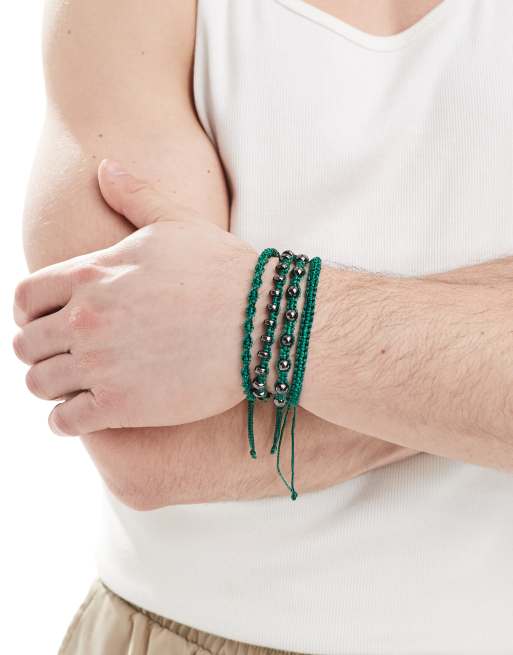 ASOS DESIGN 4 pack fabric bracelets with metallic beads in forest green