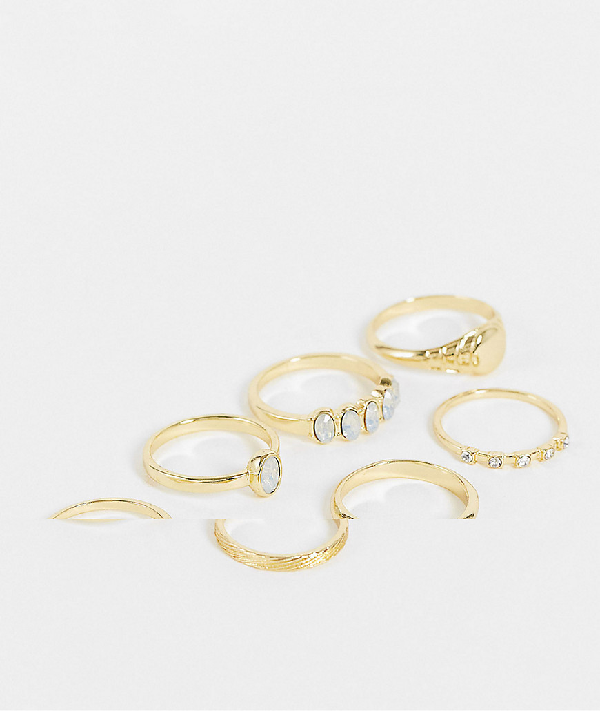 ASOS DESIGN 7-pack rings in mixed crystal designs in gold tone