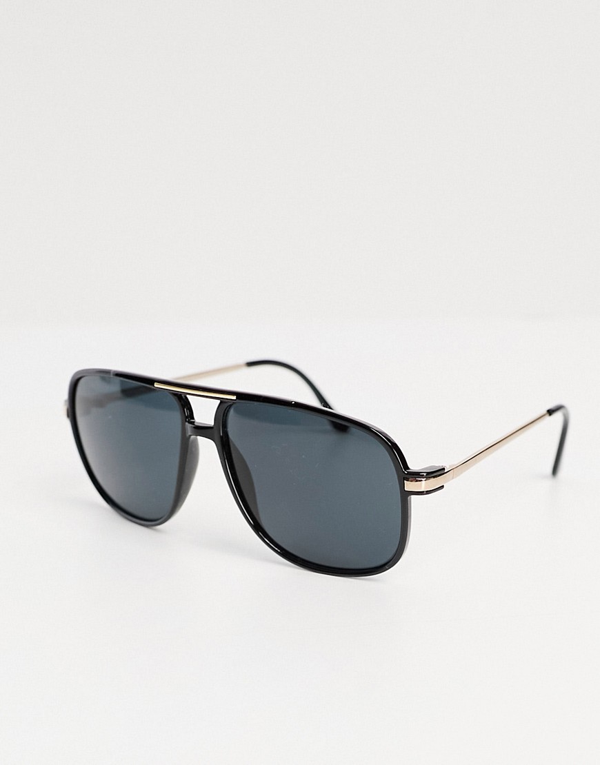 ASOS DESIGN 70’s aviator sunglasses with smoke lens and gold detail frame in black