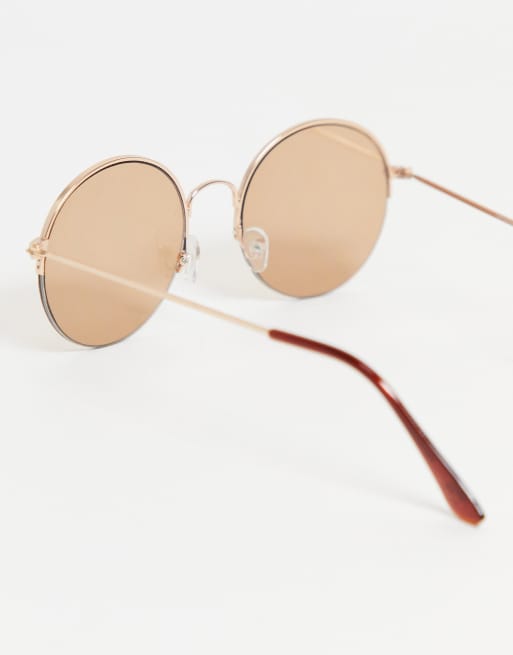 ASOS DESIGN 70s round sunglasses with light brown lens in gold