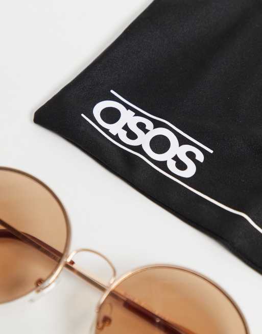 ASOS DESIGN 70s round sunglasses with light brown lens in gold