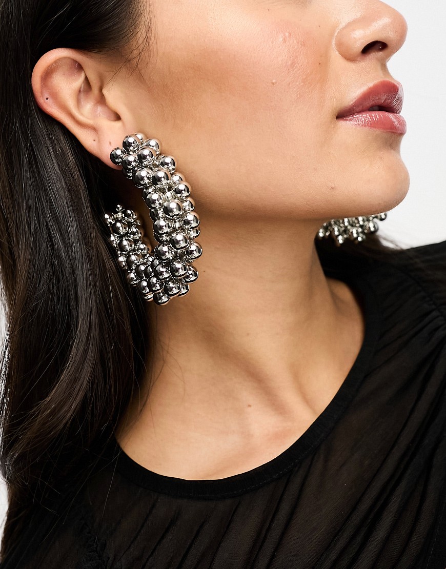 ASOS DESIGN 75mm hoop earrings with multi ball design in silver tone