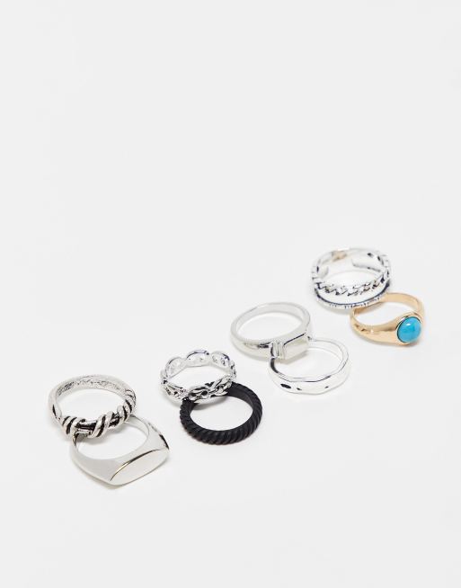 ASOS DESIGN 8 pack rings with blue in mixed metals ASOS