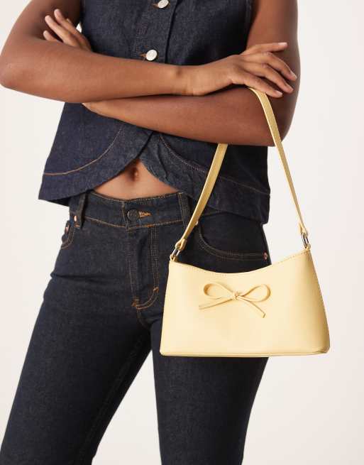 ASOS DESIGN – 90er-Jahre Schultertasche in Buttermilchgelb mit Schleife, 2 von 4