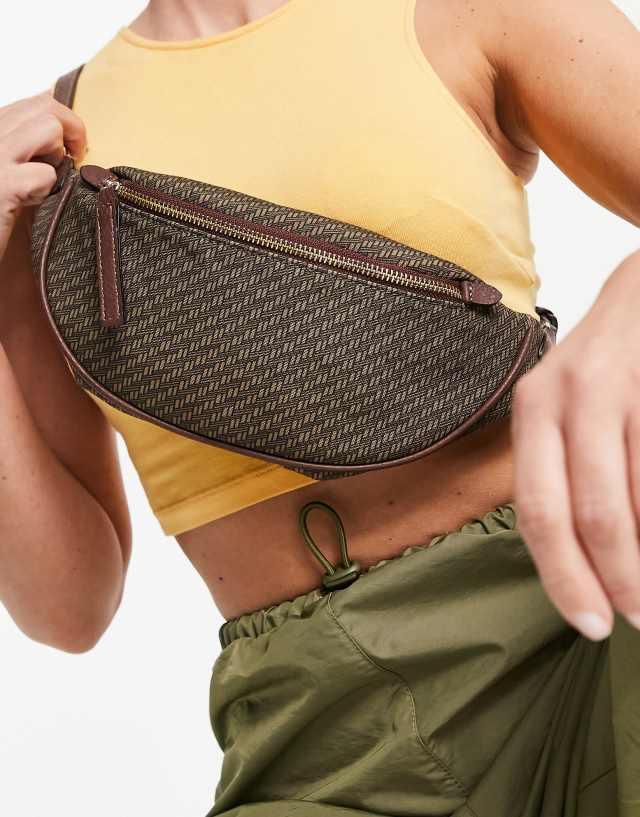 ASOS DESIGN 90s monogram fanny pack in brown