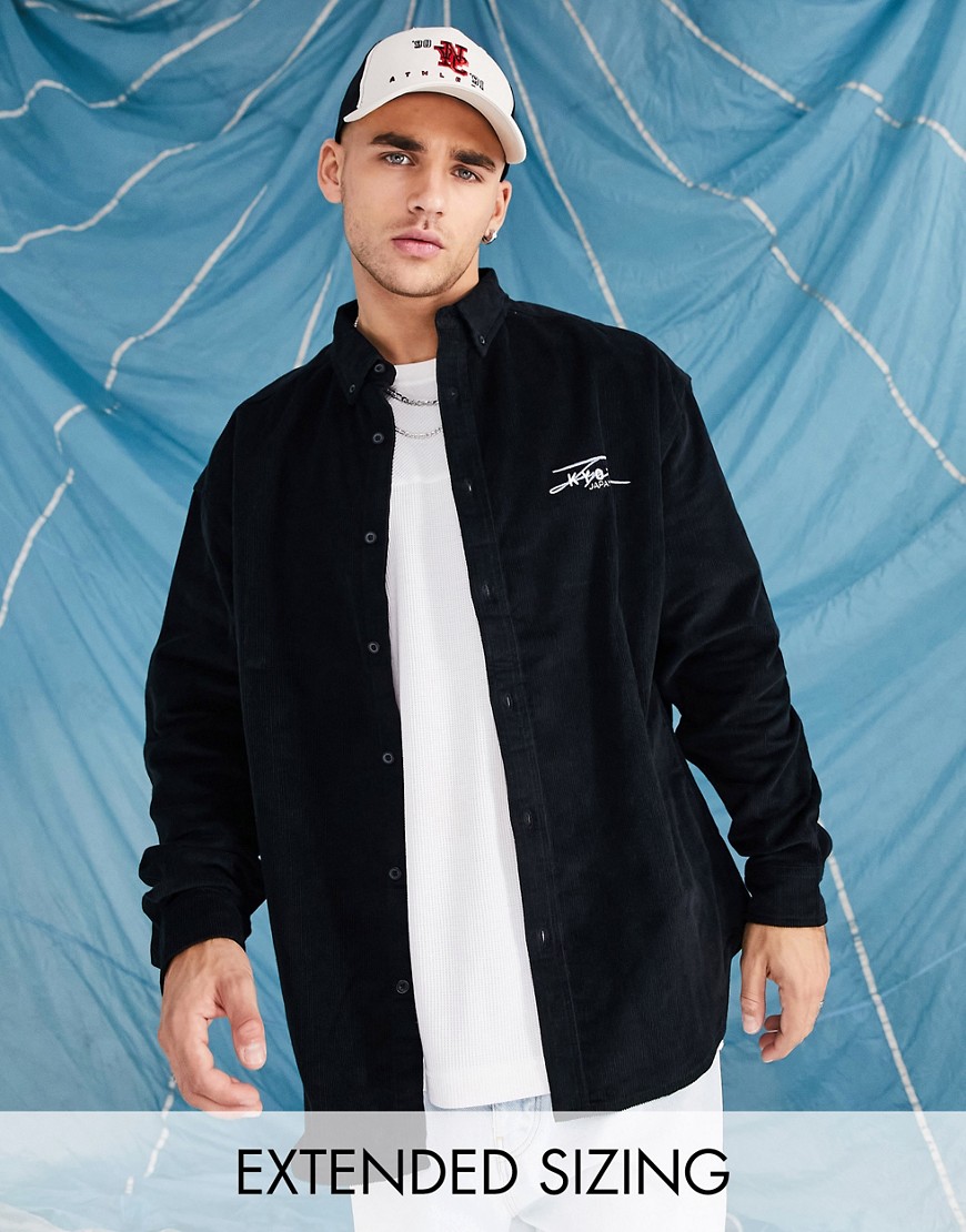 ASOS DESIGN 90s oversized cord shirt in black with city chest embroidery
