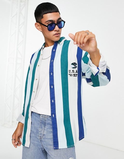 ASOS DESIGN 90s oversized collegiate stripe twill shirt with basketball embroidery