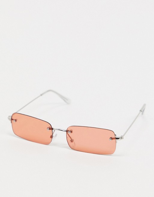 ASOS DESIGN 90s rimless rectangle sunglasses in silver metal with orange lens