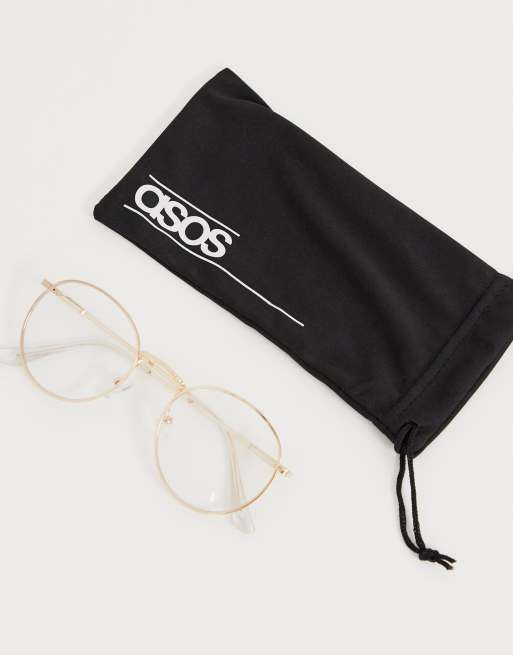 ASOS DESIGN 90s round metal sunglasses with clear lens in gold, 2 of 4