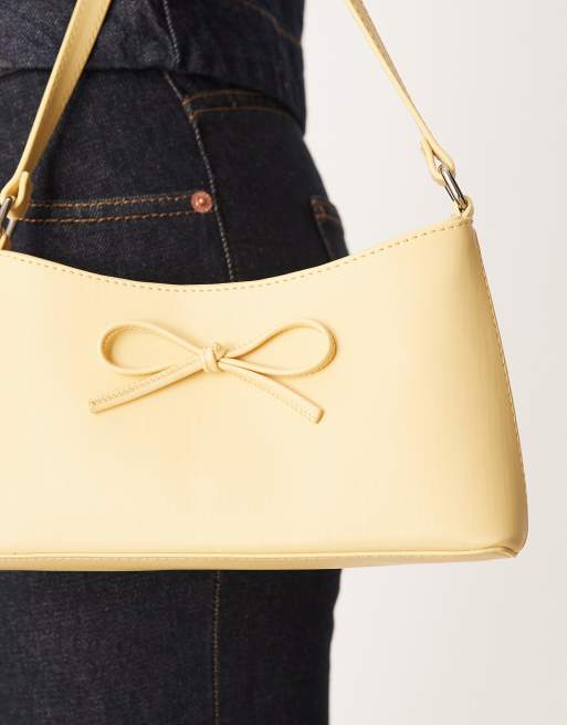 ASOS DESIGN 90s shoulder bag with bow in buttermilk