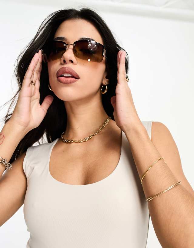 ASOS DESIGN 90s wrap rimless sunglasses in brown