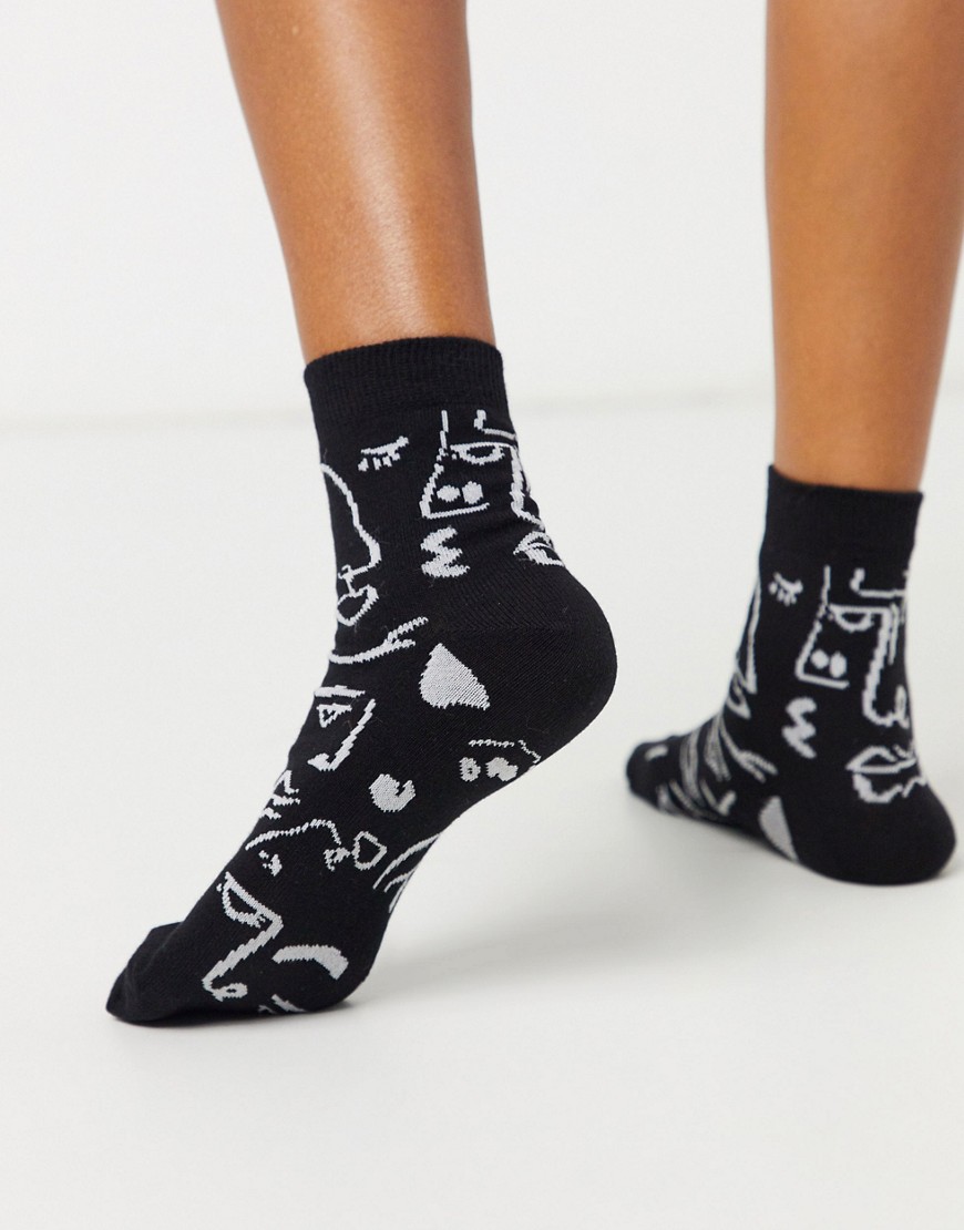 ASOS DESIGN abstract face print ankle socks in black