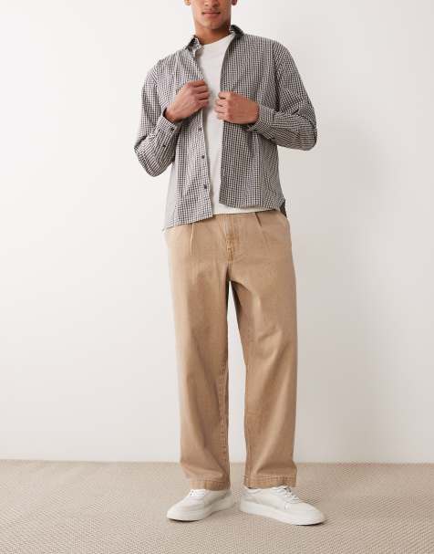 ASOS DESIGN - Afslappede tapered jeans i brun vask med plisseringer - view 1