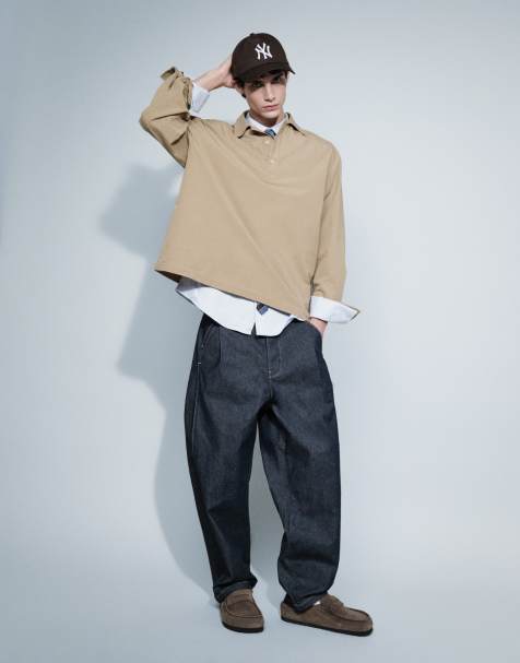 ASOS DESIGN - Afslappede tapered jeans i rå denim med plisseringer og spænde - view 1