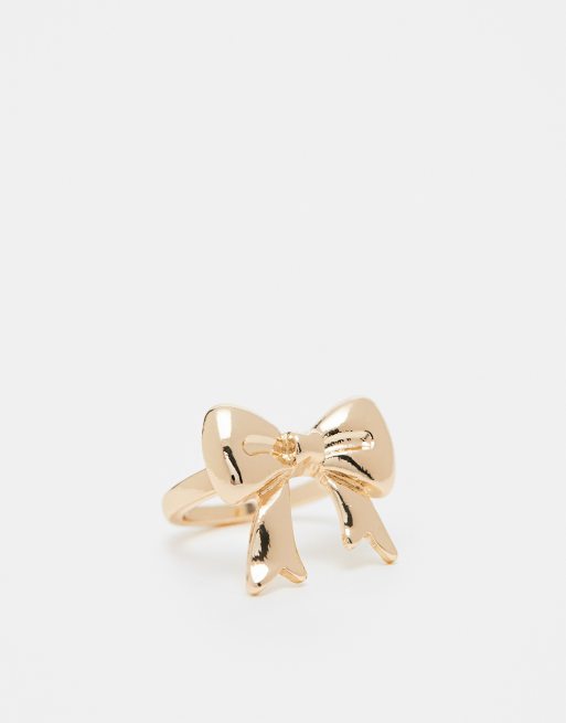 ASOS DESIGN - Anello con fiocco color oro
