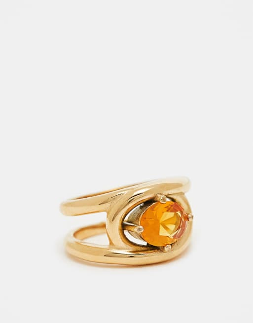 ASOS DESIGN - Anello in acciaio inossidabile resistente all'acqua dorato con cristallo ambra