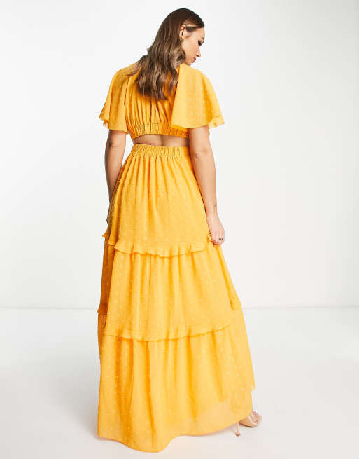 ASOS DESIGN angel sleeve plunge dobby tiered maxi dress with cut out and rouleux detail in mustard