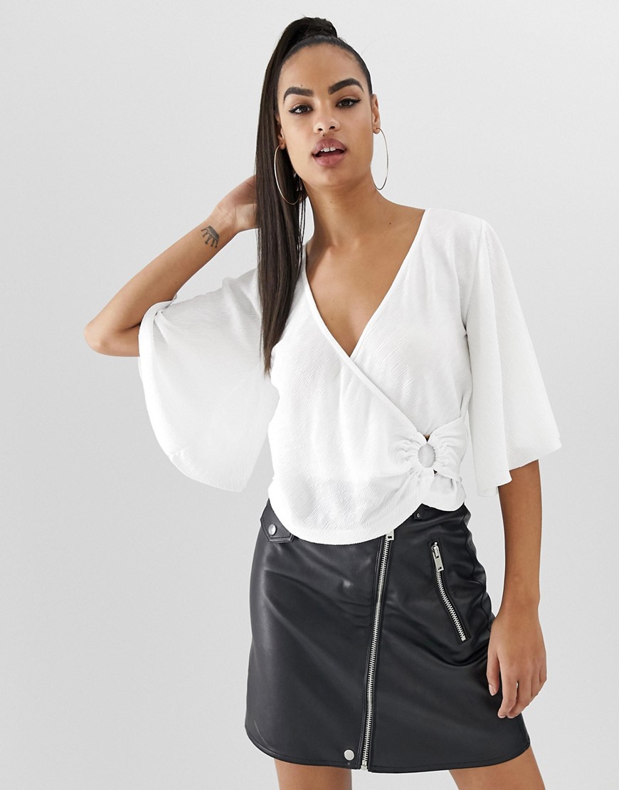 ASOS DESIGN angel sleeve textured jersey wrap top with ring detail-White
