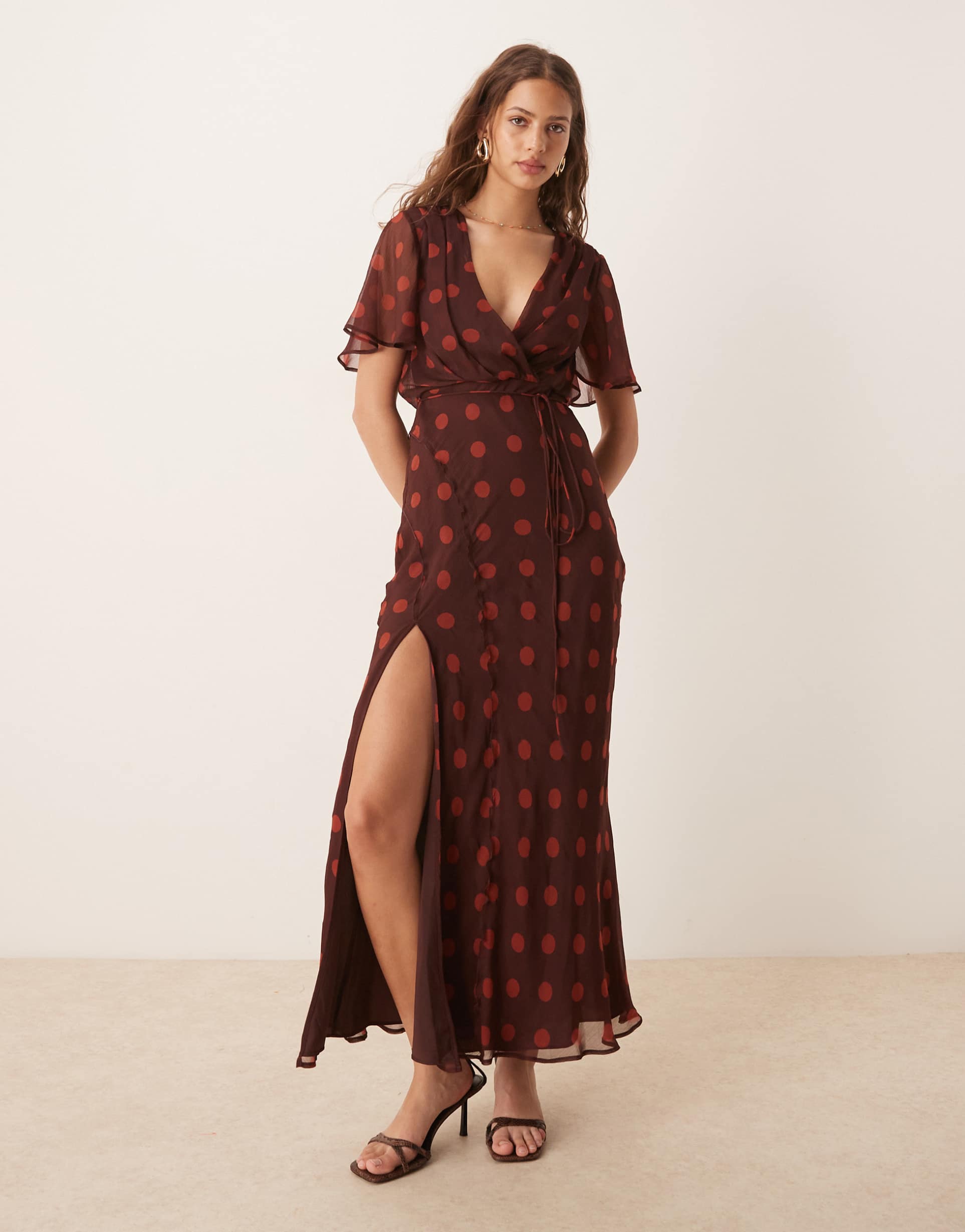 asos design angel sleeve wrap front maxi dress with seaming details in cherry polka dot print