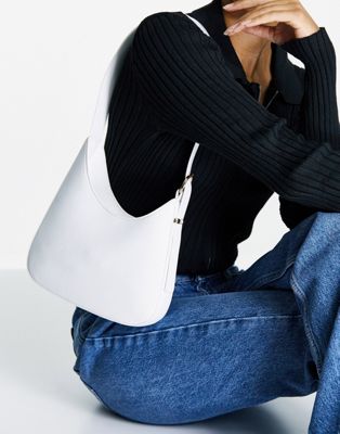 ASOS DESIGN angled shoulder bag with buckle in white