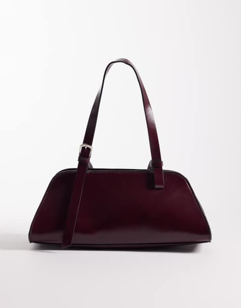 ASOS DESIGN angular bowler bag with buckle strap detail in burgundy - view 1