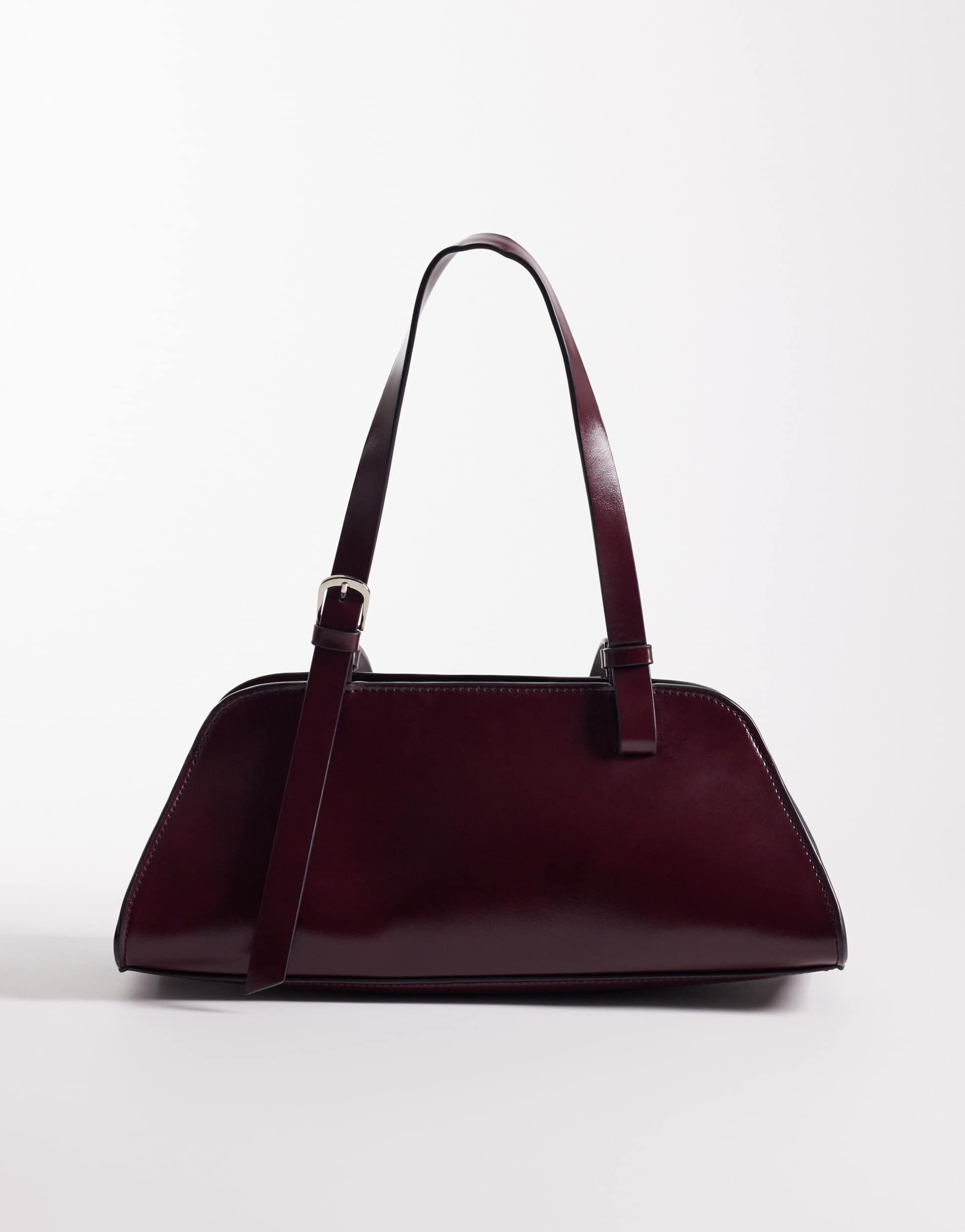 asos design angular bowler bag with buckle strap detailing in burgundy