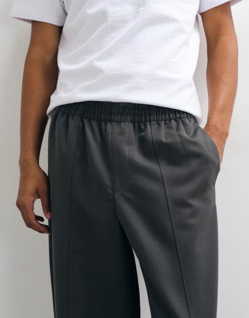 ASOS DESIGN Anzughose mit elastischem Bund, Oversize, konisch zulaufend in Anthrazit, 3 von 5