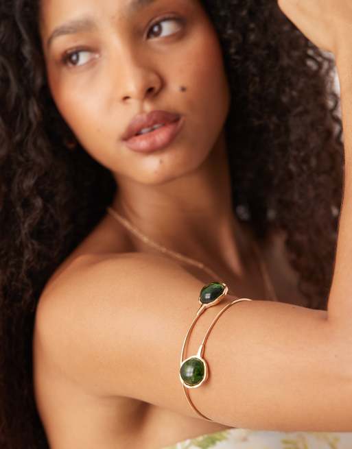 ASOS DESIGN arm cuff with green resin details in gold tone