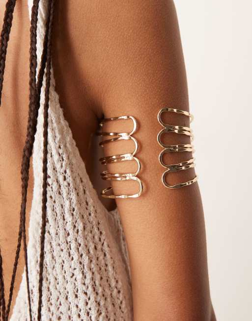 ASOS DESIGN arm cuff with hammered wraparound design in gold tone