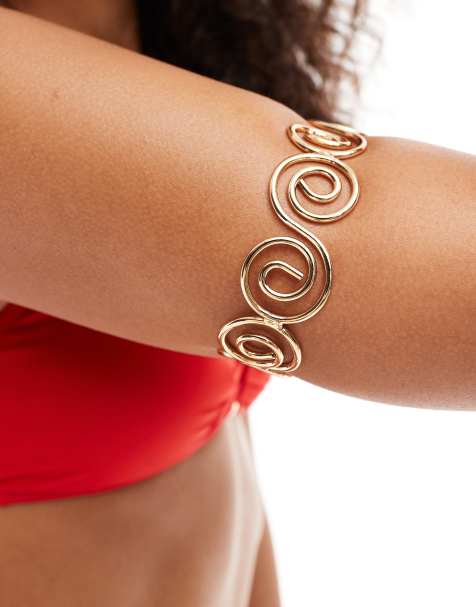 ASOS DESIGN arm cuff with swirl design in gold tone - view 1