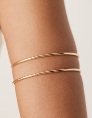 arm cuff with two banded detail in gold tone