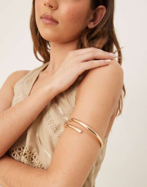 ASOS DESIGN arm cuff with wraparound design in gold tone