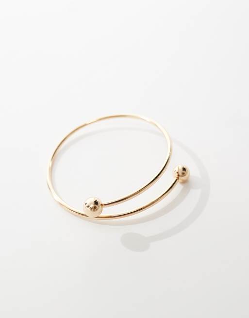 ASOS DESIGN arm cuff with wraparound design with ball ends in gold tone, 3 of 4