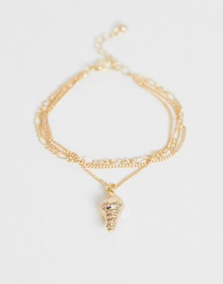 ASOS DESIGN - Armband met meerdere lagen, figaro-ketting en schelpbedel in goudkleur