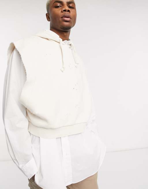 ASOS DESIGN – Ärmelloser, kurz geschnittener Kapuzenpullover im Used-Look in Beige