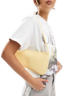 asymmetric buckle shoulder bag in buttermilk yellow