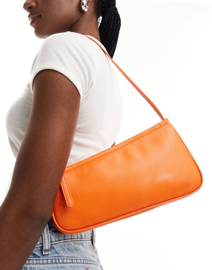 asymmetric buckle shoulder bag in orange